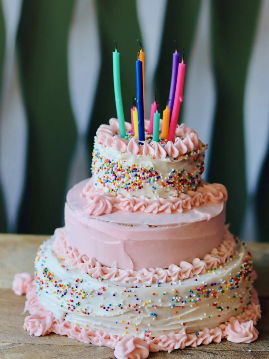 A birthday cake with lit candles